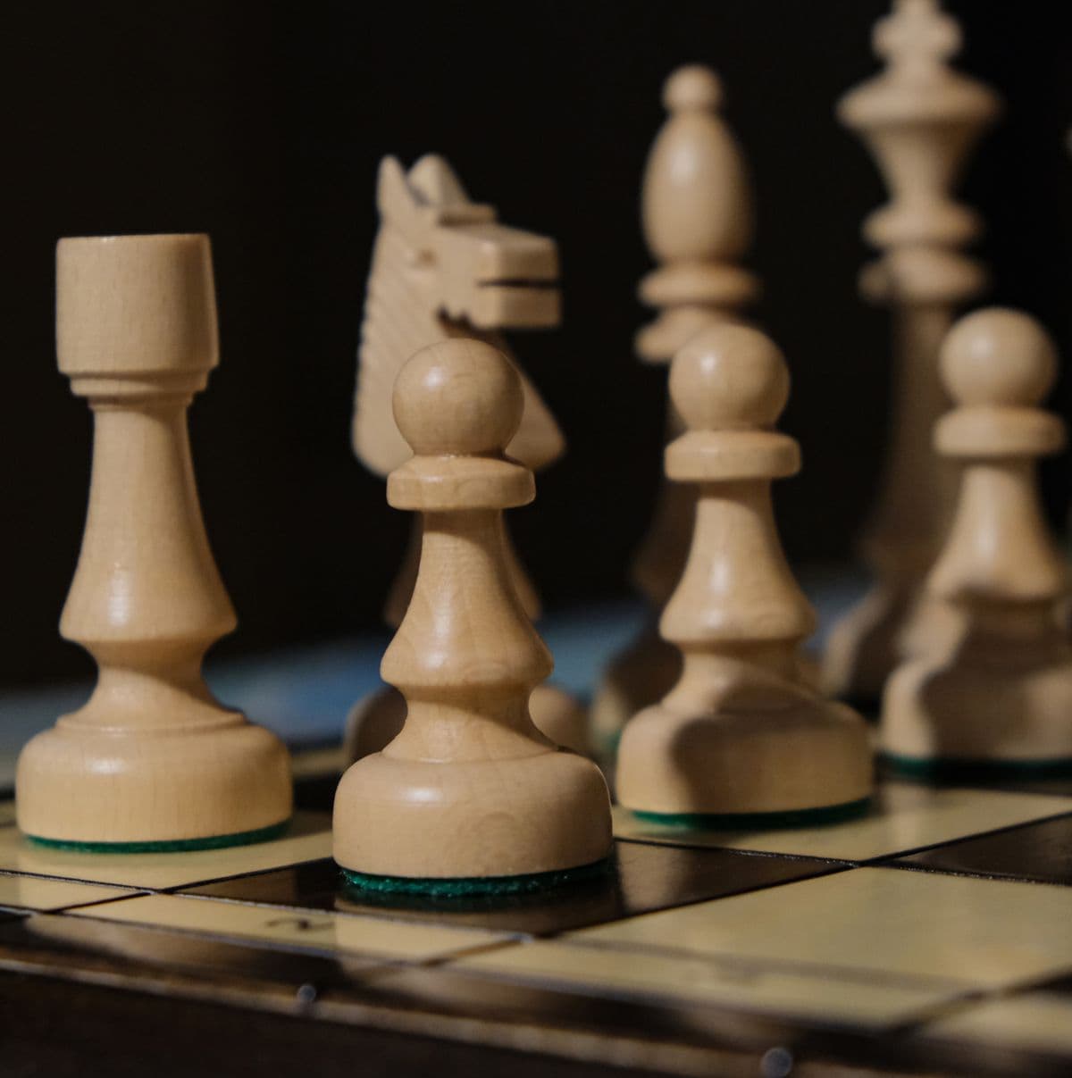 Pawns lined up on a chess board