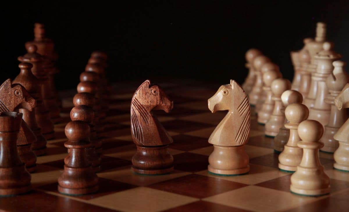 Knights facing each other across a board