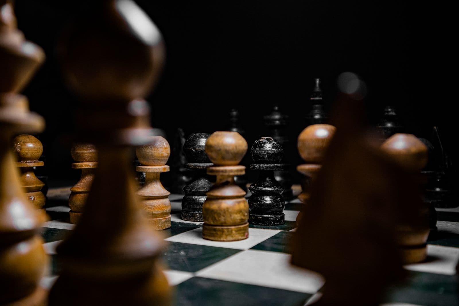 A wooden chess set on a board